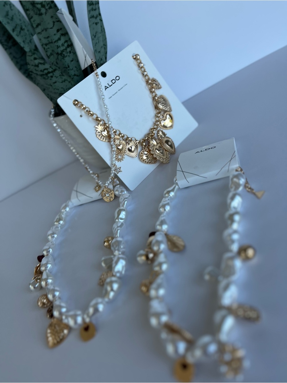 Brand new 4 piece ALDO necklace set